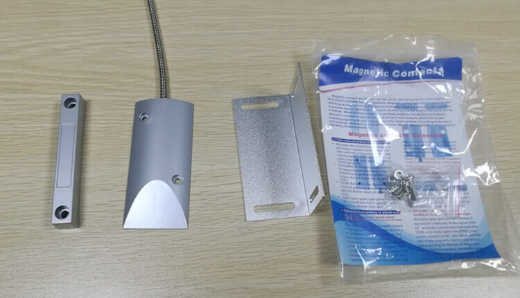 Magnetic normally closed reed switch security door contacts